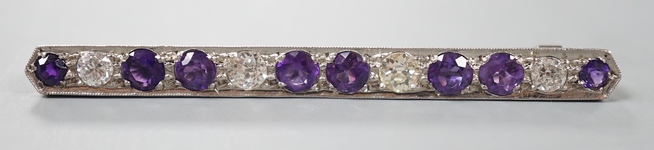 A mid 20th century white metal, amethyst and diamond set bar brooch, 57mm, gross weight 4.5 grams.